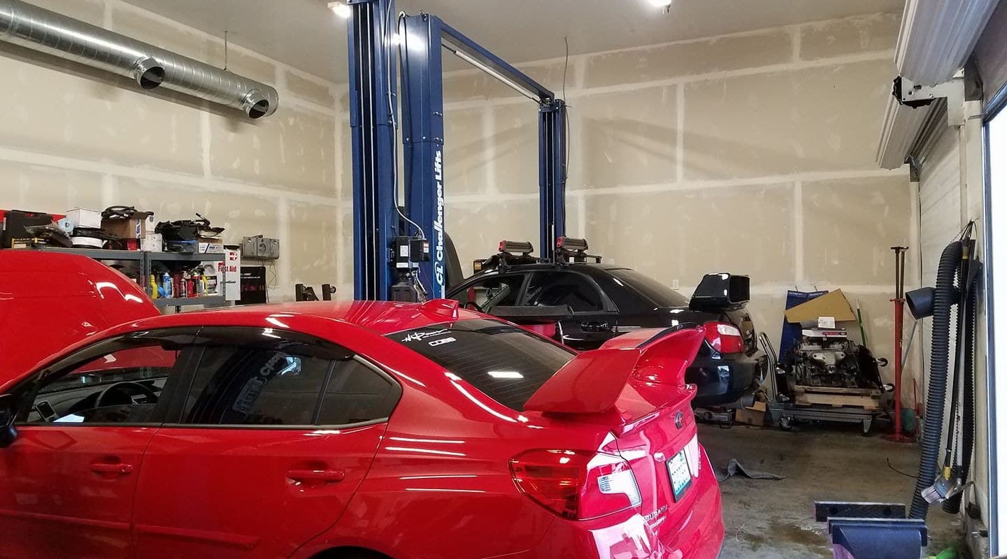 A car in our bay with the hood up
