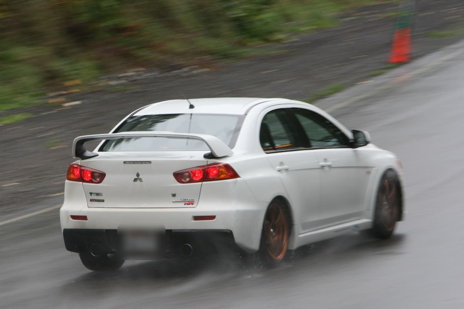 One of our cars on a wet road course